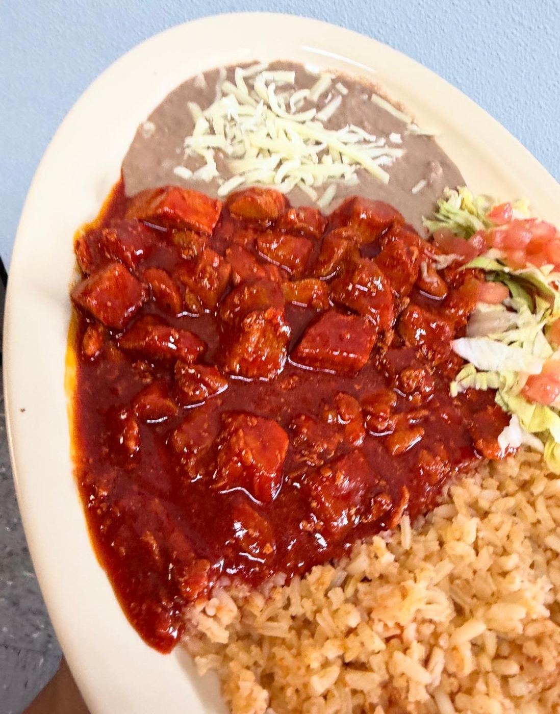 Asado de puerco rojo plate with Mexican rice, refried beans and salad at Maribu's Mexican Restaurant, El Paso TX 79938