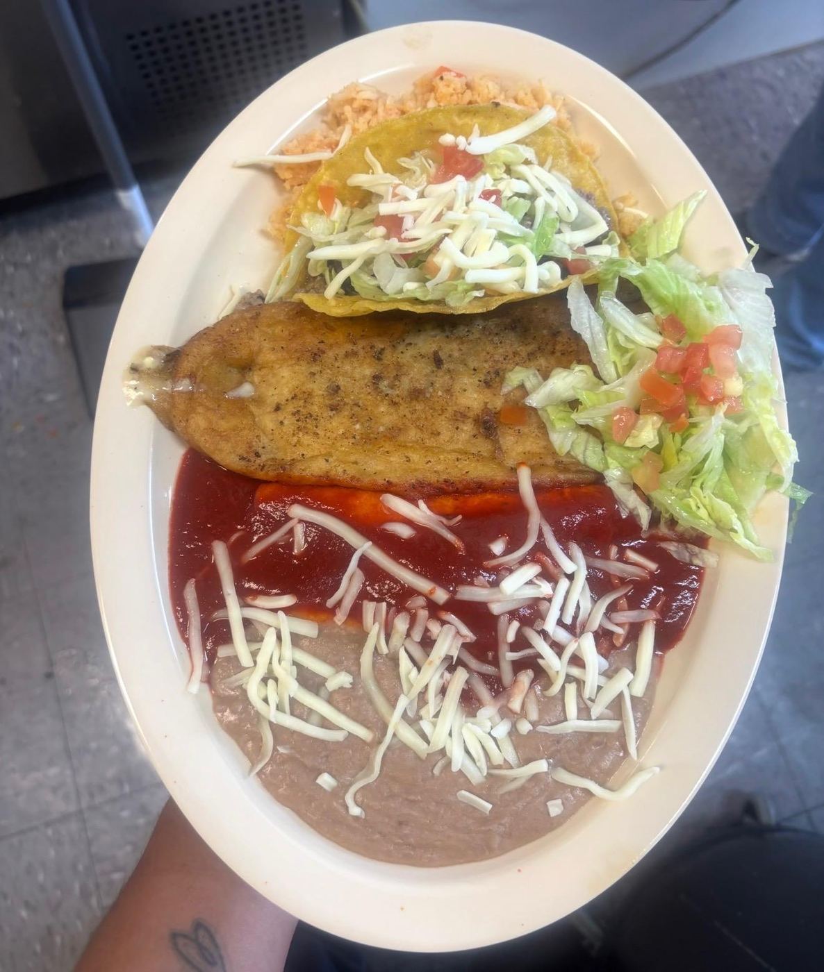 Chile relleno plate with a crispy taco, rice, beans and salad at Maribu's Mexican Restaurant, El Paso TX